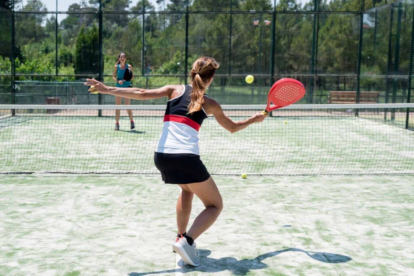 Woman playing padel tennis outdoor